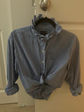 Blue micro-gingham ruffled collar top on hanger with front knot detail
