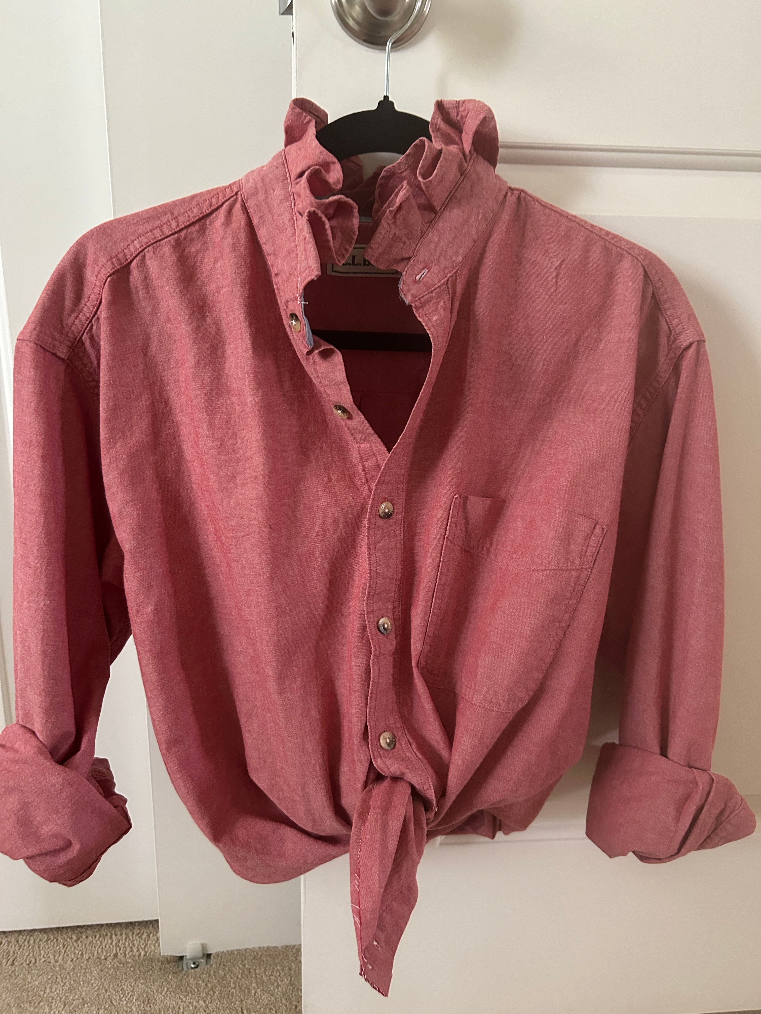 Dusty rose chambray ruffled collar top on hanger with front knot detail