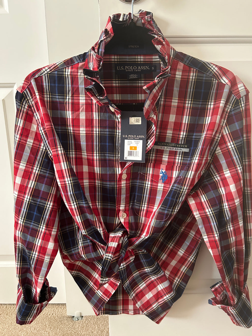 Meet Roberta a Red and Navy plaid button down shirt with ruffled collar