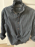 Addie is a navy, green and white plaidwith a beautiful ruffled collar