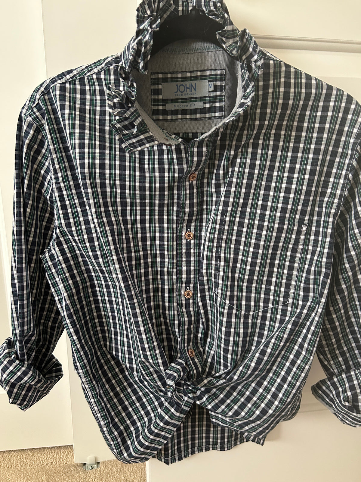 Addie is a navy, green and white plaidwith a beautiful ruffled collar